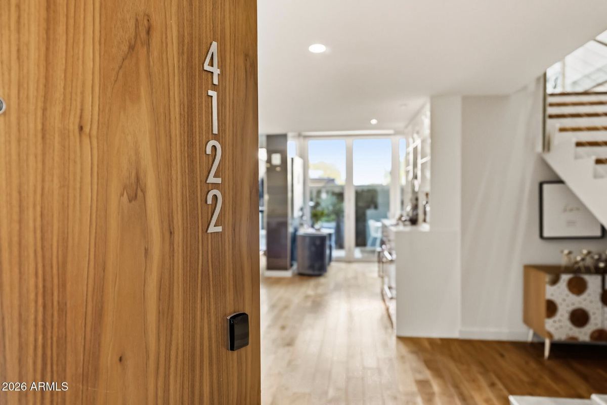 Walnut entry door & wide-plank wood floors