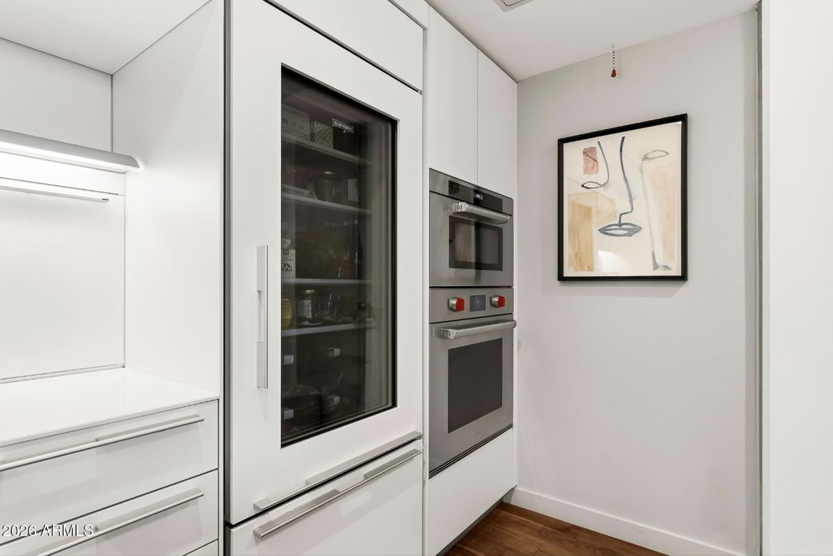 Glass-front Sub-Zero refrigerator & Wolf wall ovens