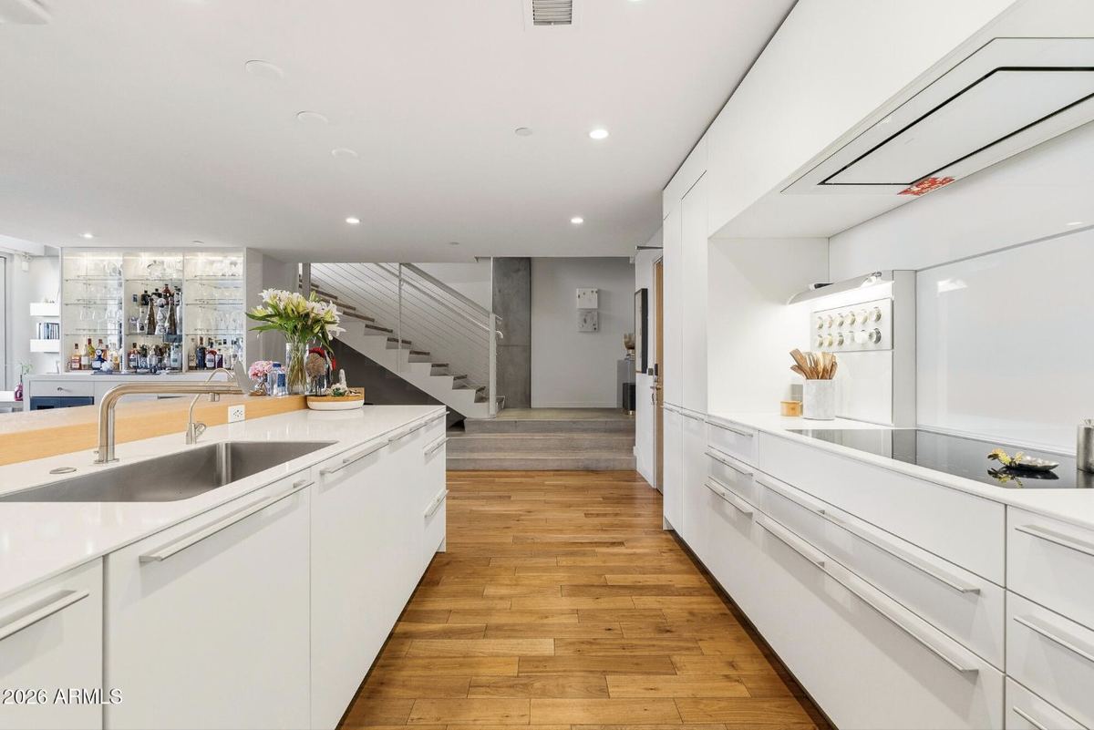Galley kitchen toward the bar & floating stair