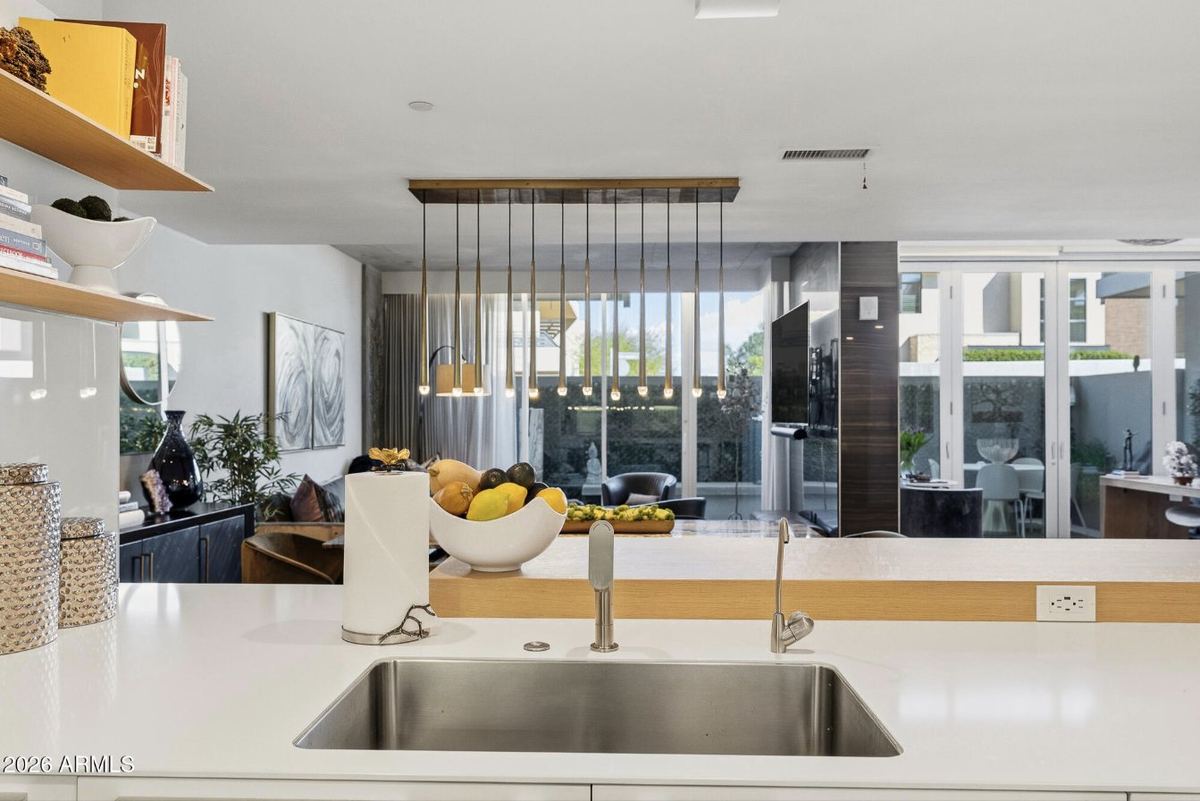 Kitchen sink view to the living room & garden