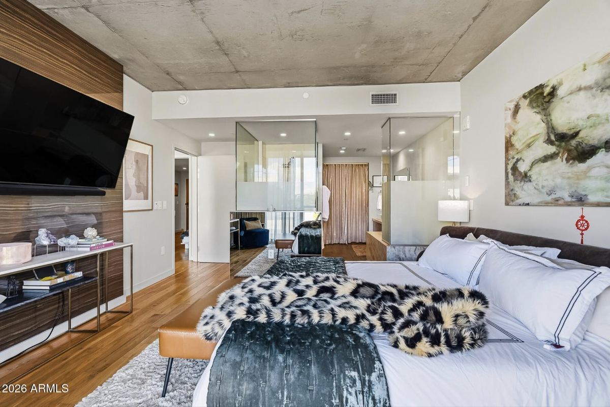 Primary suite toward the glass-enclosed bath
