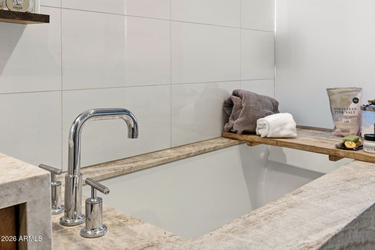 Stone-surround soaking tub