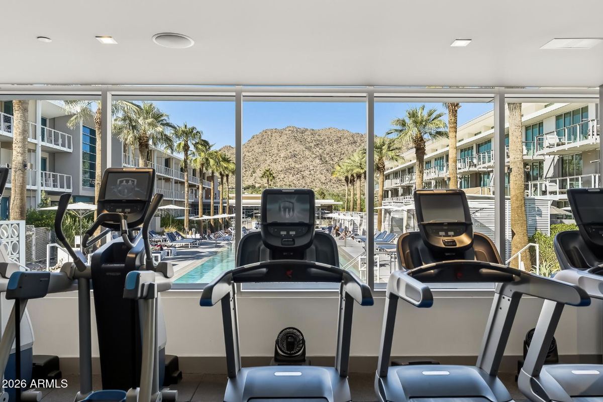 Fitness center overlooking the resort pool & Camelback